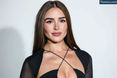 Olivia Culpo - a woman with a very big breast posing for a picture