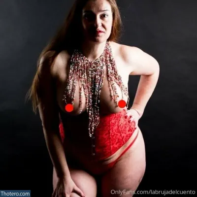 labrujadelcuento - woman in red lingerie posing for a picture