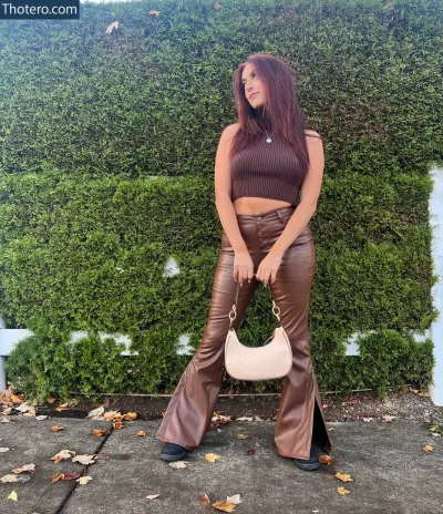 Sweetxcherry - woman in brown top and leather pants posing for a picture