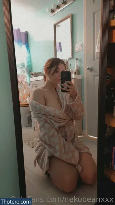 MidnightVulpi - woman sitting on the floor taking a selfie in a bathroom