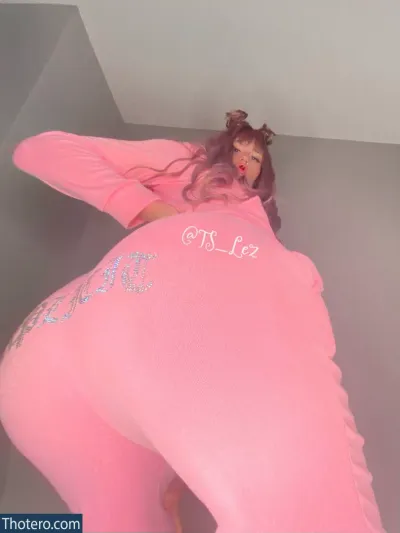 Leslie - in a pink outfit is posing for a picture