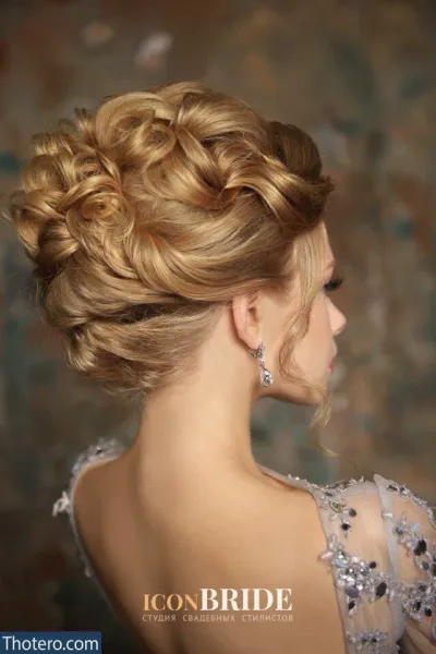 Anastasiya Ukolova - a woman with a braid updo in a dress