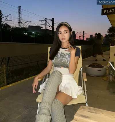 Waterlynn - sitting on a chair in a chair with a shirt on