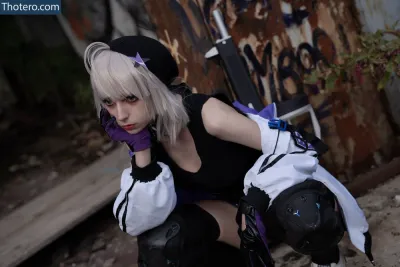 Himeecosplay - blond haired woman in black and white outfit crouching down with knee pads