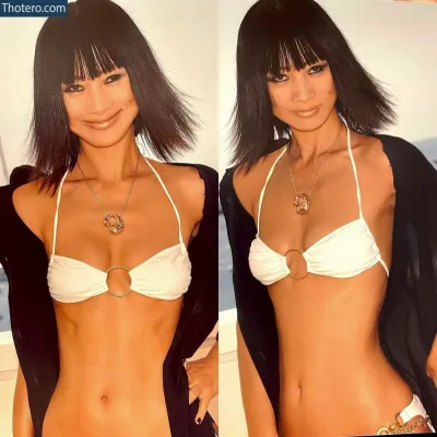 Bai Ling - woman in a white bikini and black jacket posing for a picture