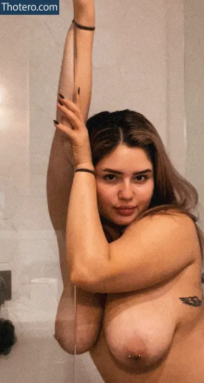 Francikath - woman in a bathroom taking a selfie with a shower head