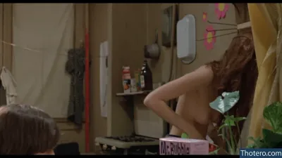 Susan Sarandon - woman standing in a room with a box of pink stuff