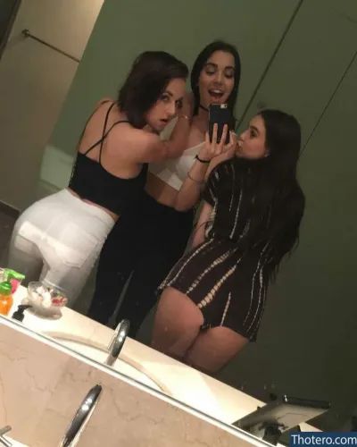 Alexis G Zall - three women taking a selfie in a bathroom mirror