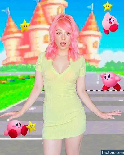 Cindy Paola - woman in a yellow dress holding a pink ball and a pink mario bros