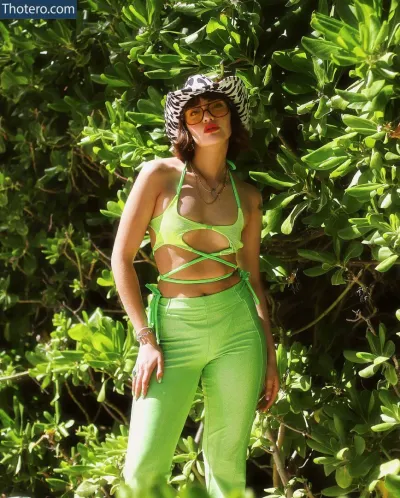 Marta Rodríguez - woman in a green bikini top and green pants posing for a picture
