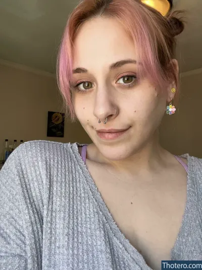 hunnyymustarddx - woman with pink hair and piercings in a room