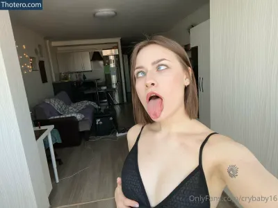 Dasha - there is a woman sticking out her tongue in a room