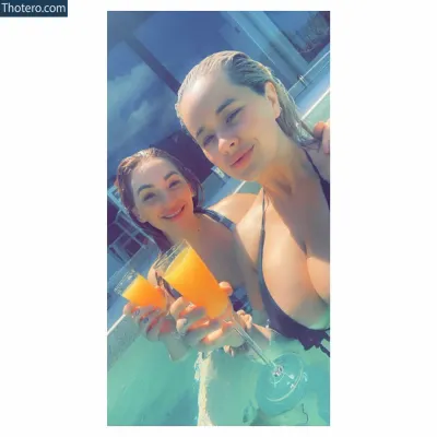 Kathryn - two women in a pool with drinks and orange juices