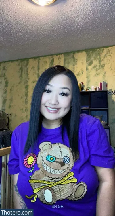Tripleddk - woman with a purple shirt and a teddy bear