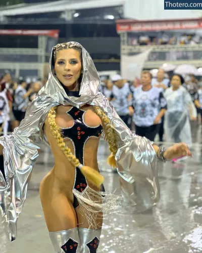 Ana Paula Minerato - dressed in a silver costume and a long braid