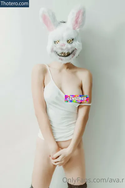 Ava.R - woman in a bunny mask holding a candy bar