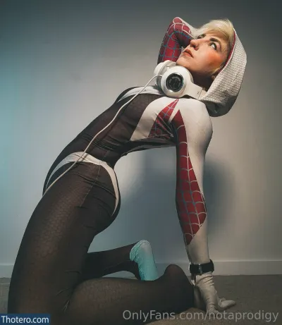 Notaprodigy - woman in a spider - man costume with headphones on