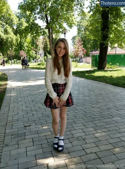 chloe_ira - girl in a skirt and sweater posing for a picture