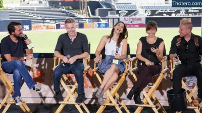 Laura Bailey - several people sitting in chairs and talking on a stage