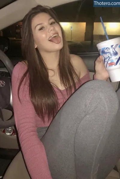 Harmony Brazeal - girl sitting in a car with a drink and a drink in her hand