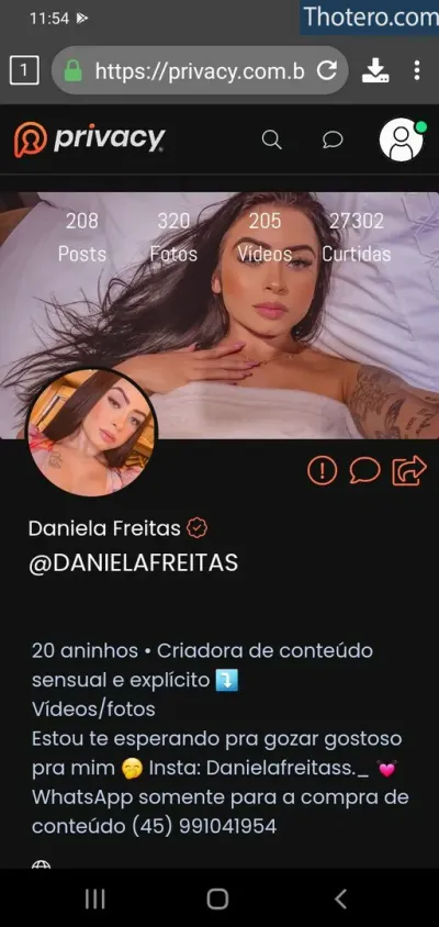 Daniela Freitas - a close up of a person laying in bed with a phone