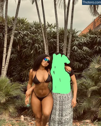 Vitoria Oliveira - there is a woman in a bikini and a man in a bikini posing for a picture