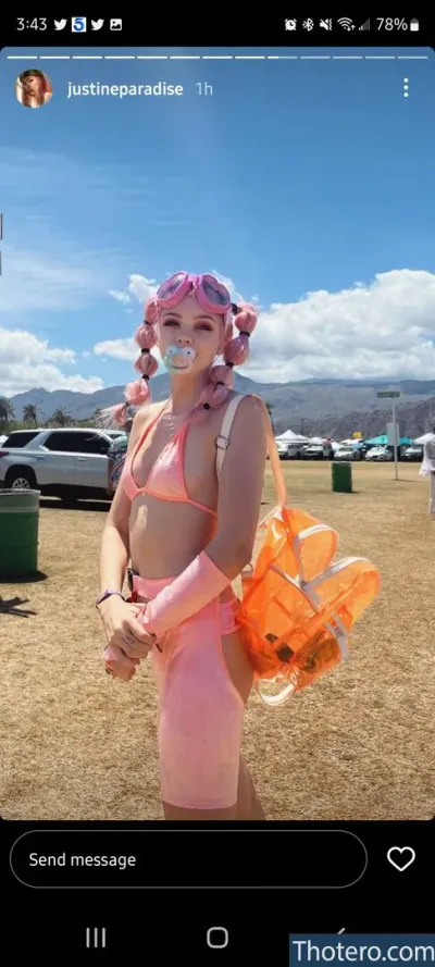 Justine Paradise - a close up of a person in a pink outfit with a bag