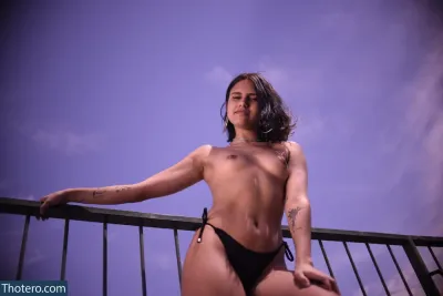 lilvenecia - woman in a black bikini posing on a balcony