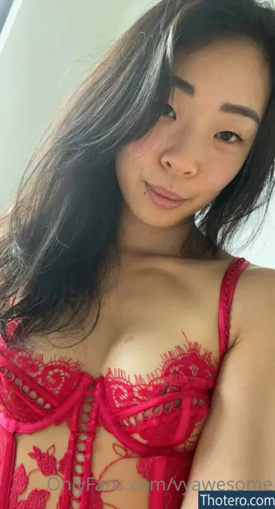 VyAwesome - a close up of a woman in a red lingerie posing for a picture