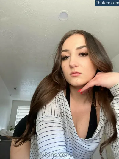 freshmenashley - woman with long brown hair and a black top