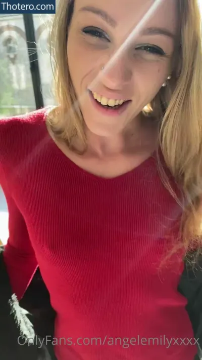 Angel Indeed - a close up of a woman in a red shirt smiling