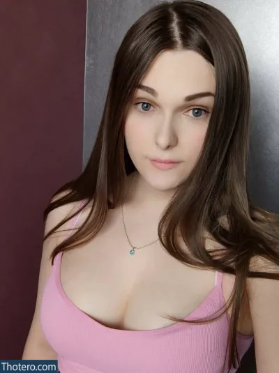 Maddison Swift - a close up of a woman in a pink top posing for a picture