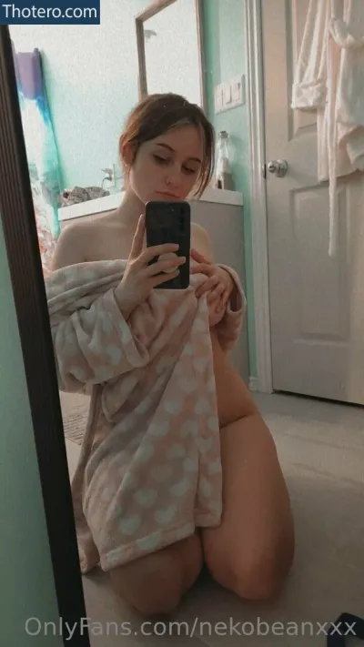 MidnightVulpi - woman sitting on the floor taking a selfie in a bathroom