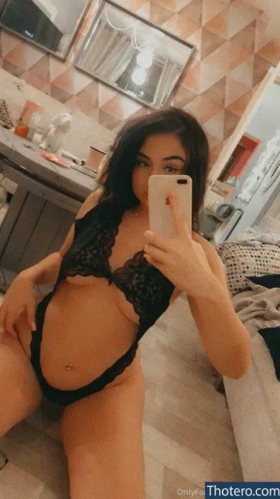 Cjay Natalie - woman in a black lingerie taking a selfie