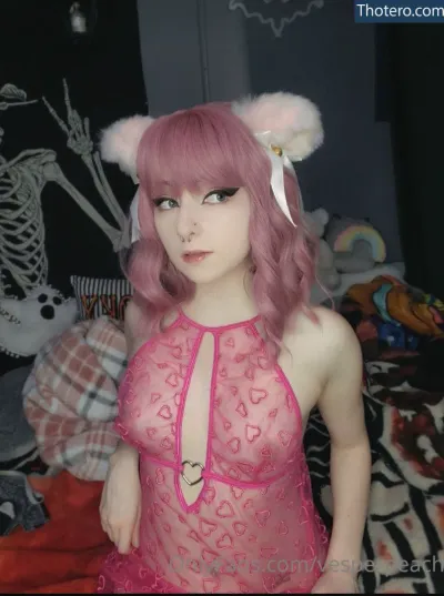 Peachgore - woman in a pink dress posing for a picture