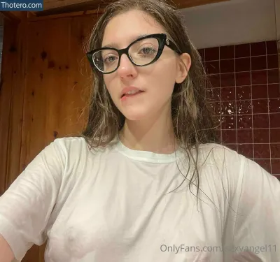 Sexyangel11 - there is a woman with glasses and a white shirt taking a selfie