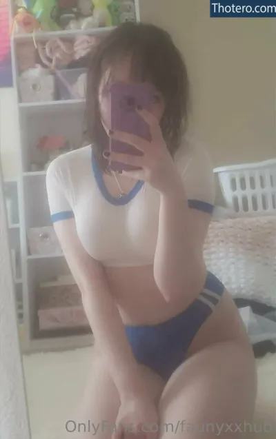 faunyxxhub - woman in a white shirt and blue panties taking a selfie