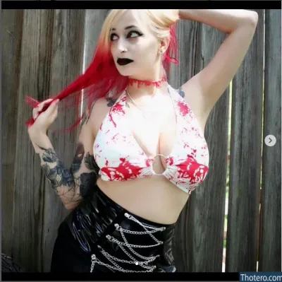 The_Bloodwitch - woman with red hair and a white top posing for a picture