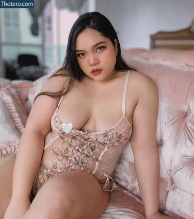 chubbypreeya - woman in a pink lingerie sitting on a bed