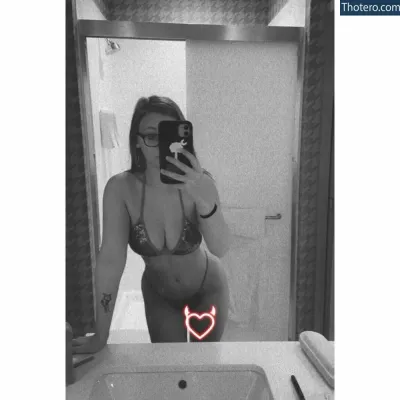 brittanyciara - woman in a bikini taking a selfie in a bathroom mirror