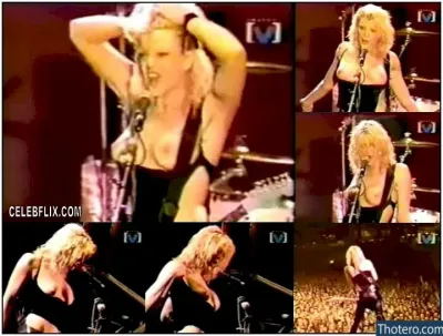 Courtney Love - image of a woman in a black dress singing on stage