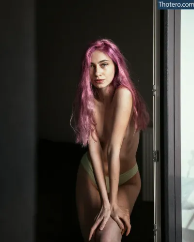 onny.nudes - woman with pink hair posing in a doorway