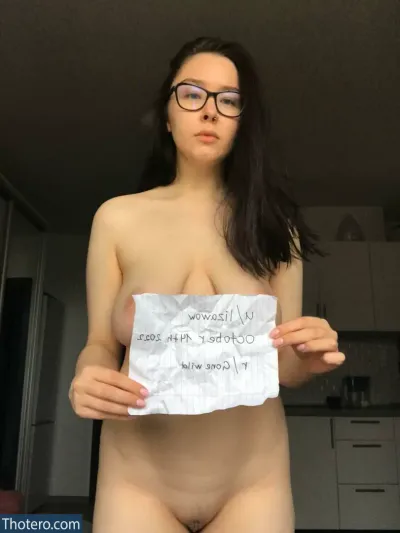 lizawow - a woman with glasses holding a sign that says, i'm not allowed